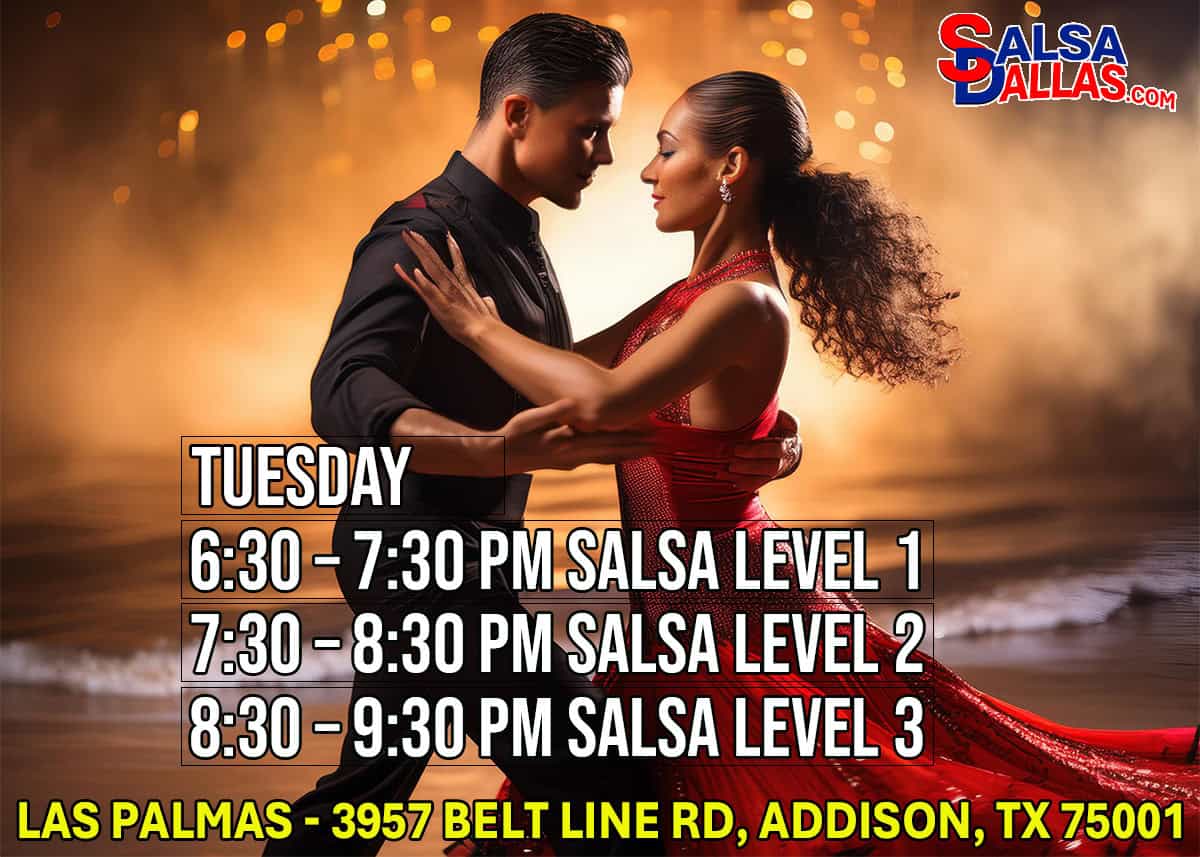 Dance couple practicing salsa dance in a warm, romantic setting with a sunset background.